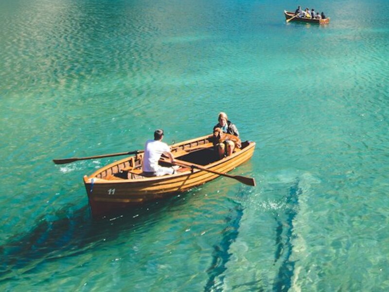 The same rowboat seen up close — you can read the number 11 and see the two people rowing.