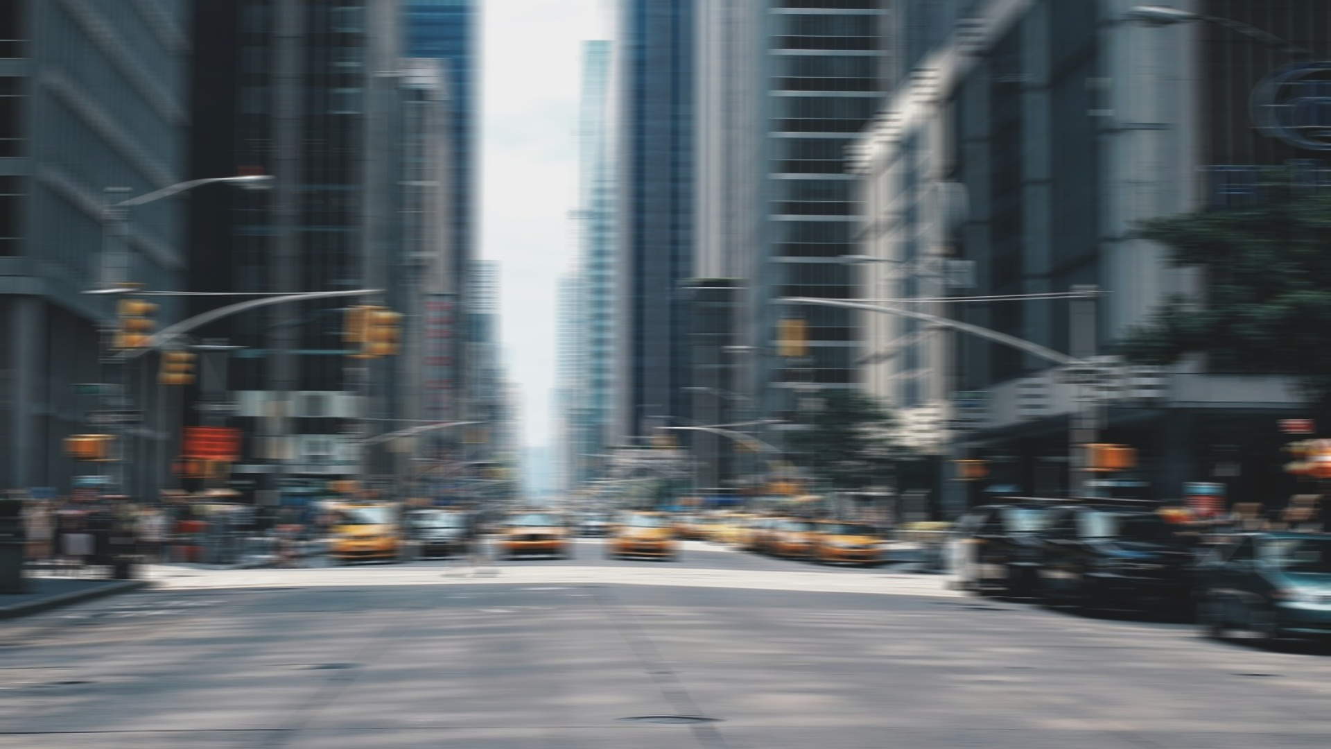 A busy city street pressed too soon — everything is a blur of cars and nothing has lined up yet.