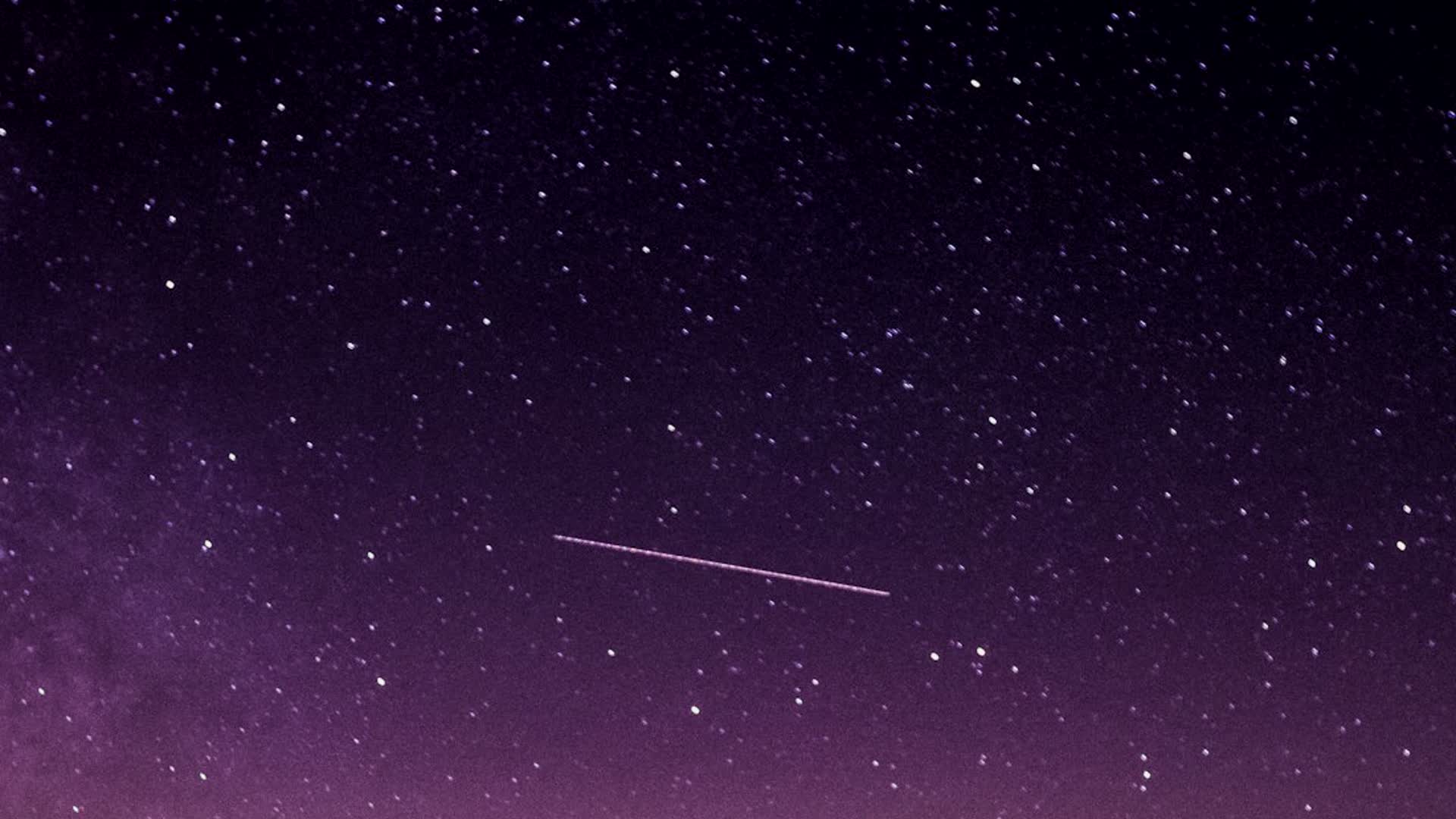 A quick snap in the dark — the shutter closed fast, so the moving light is just a tiny frozen dot.