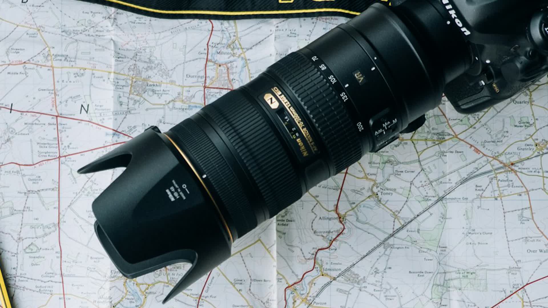 Detail shot: a close-up of the camera lens resting on the map.